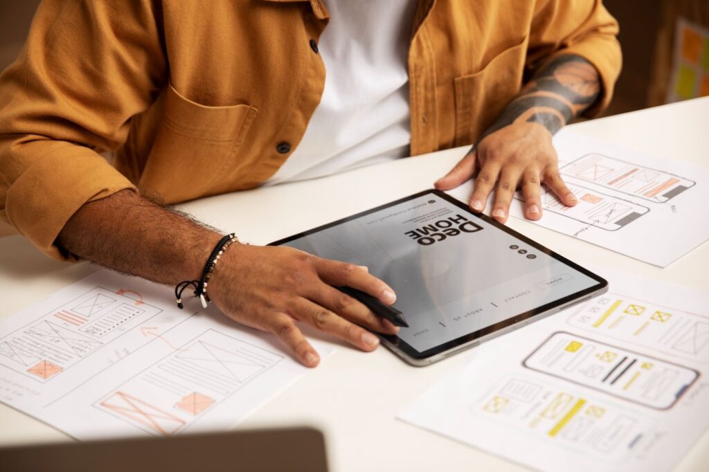 Man working with tablet on app design