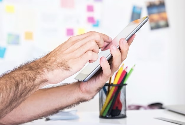 Finger presses on tablet screen